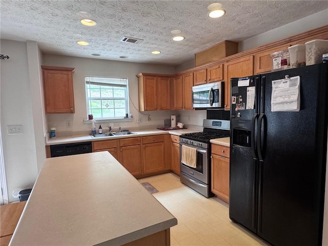 5421 Skylar Creek Ln, Buford, GA 30518 - kitchen featuring appliances with stainless steel finishes, light flooring, light countertops, brown cabinets, and recessed lighting