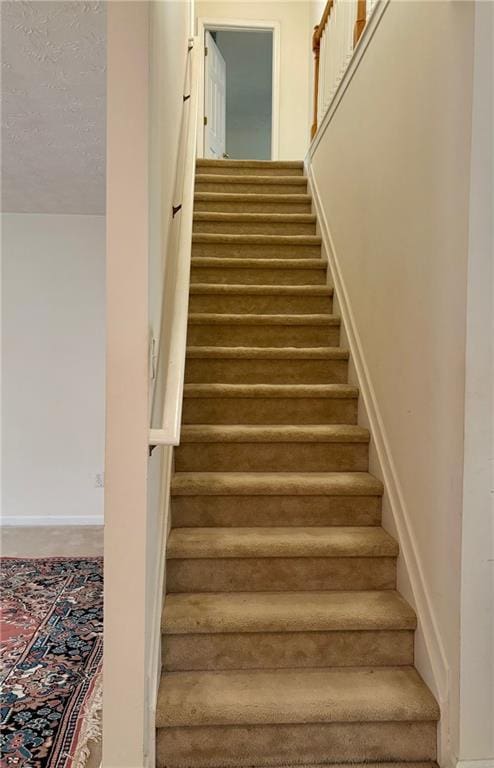 5421 Skylar Creek Ln, Buford, GA 30518 - stairs featuring baseboards