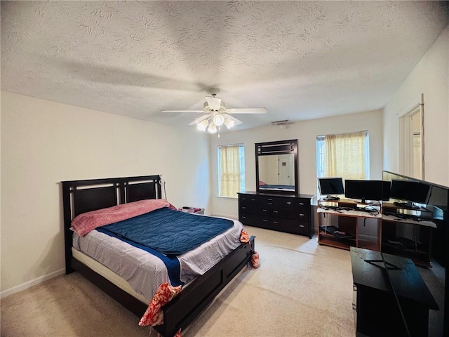 5421 Skylar Creek Ln, Buford, GA 30518 - bedroom featuring light carpet, a desk, a ceiling fan, and a textured ceiling