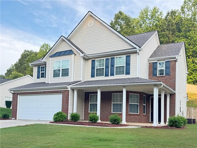 5421 Skylar Creek Ln, Buford, GA 30518 - view of front facade with a front yard, concrete driveway, brick siding, and a porch
