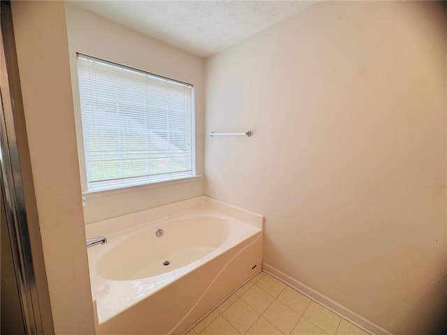 5421 Skylar Creek Ln, Buford, GA 30518 - full bathroom featuring a bath, tile patterned floors, and a textured ceiling