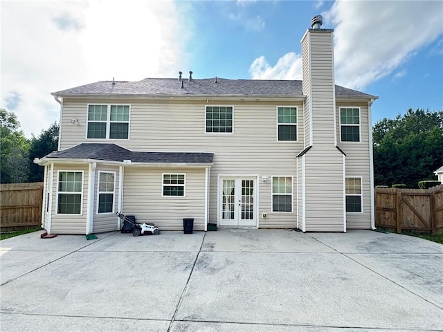 5421 Skylar Creek Ln, Buford, GA 30518 - rear view of house featuring french doors, a patio area, and a chimney