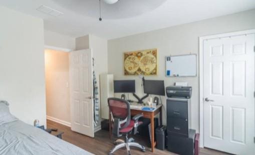 bedroom featuring dark hardwood / wood-style floors