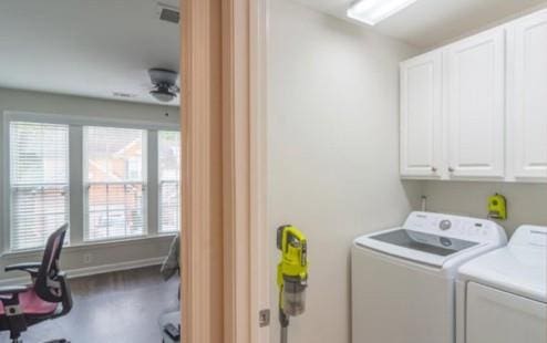 laundry area with independent washer and dryer, cabinets, and ceiling fan