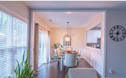 dining area featuring dark hardwood / wood-style flooring