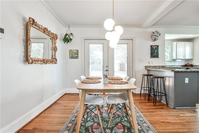 1136 Moreland Pl SE, Atlanta, GA 30316 - dining room with light wood-style flooring, crown molding, baseboards, and french doors