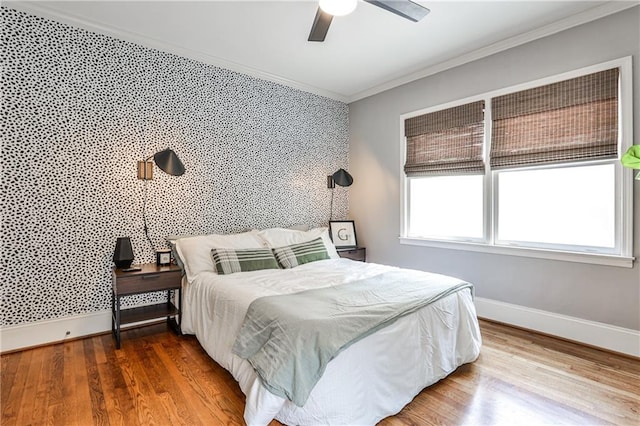 1136 Moreland Pl SE, Atlanta, GA 30316 - bedroom featuring ornamental molding, baseboards, wood finished floors, and a ceiling fan