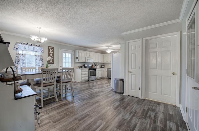 kitchen with wood finished floors, stainless steel appliances, crown molding, light countertops, and white cabinetry