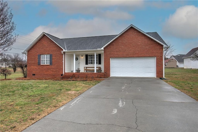 ranch-style home with driveway, brick siding, crawl space, an attached garage, and a front yard