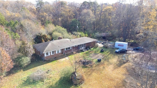 bird's eye view featuring a wooded view