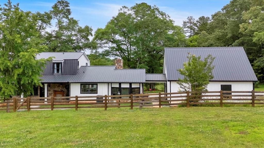 85 Carroll Slough Rd, Kingston, GA 30145 - exterior space with fence, a barn, an outbuilding, and metal roof