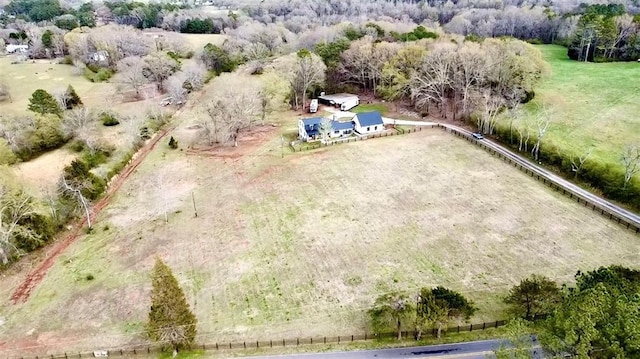 birds eye view of property with a rural view