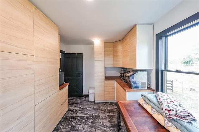 hallway with marble finish floor