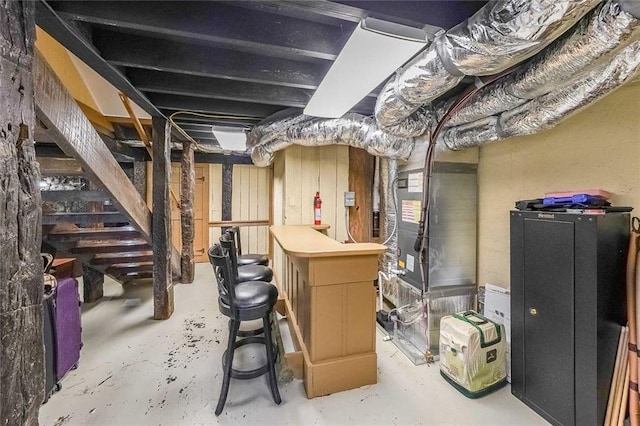 unfinished below grade area featuring heating unit