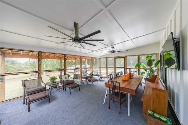 sunroom with ceiling fan and an outdoor living space