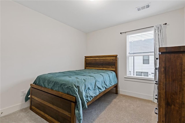 bedroom with light carpet