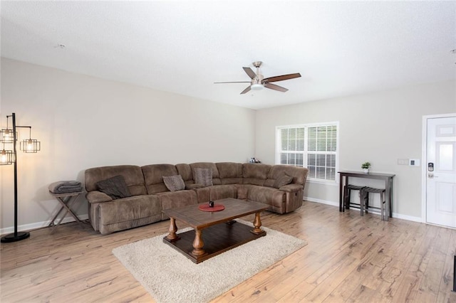 1122 Cotton Gin Dr, Woodstock, GA 30188 - living room with a ceiling fan, light wood finished floors, and baseboards
