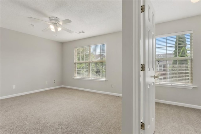 1122 Cotton Gin Dr, Woodstock, GA 30188 - carpeted spare room with plenty of natural light, ceiling fan, a textured ceiling, and baseboards
