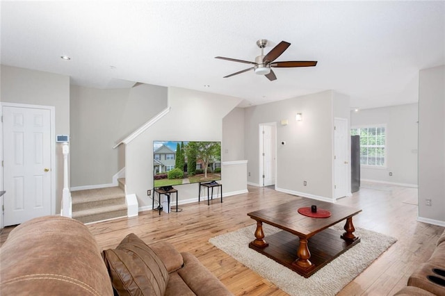1122 Cotton Gin Dr, Woodstock, GA 30188 - living area with stairway, ceiling fan, light wood finished floors, and baseboards