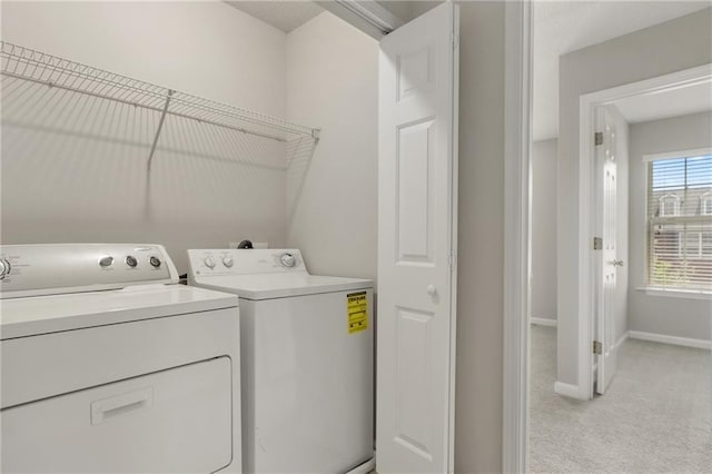 1122 Cotton Gin Dr, Woodstock, GA 30188 - washroom with light colored carpet, washing machine and clothes dryer, and baseboards