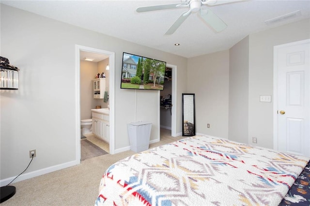 1122 Cotton Gin Dr, Woodstock, GA 30188 - bedroom with light carpet, a spacious closet, ensuite bathroom, baseboards, and ceiling fan