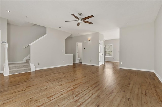 1122 Cotton Gin Dr, Woodstock, GA 30188 - unfurnished living room with ceiling fan, hardwood / wood-style floors, stairs, baseboards, and recessed lighting