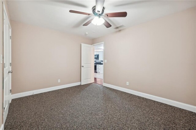 spare room featuring ceiling fan