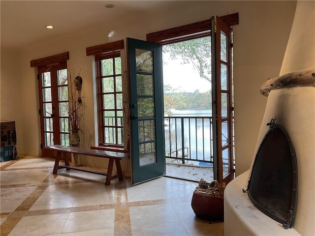 doorway with french doors, a wealth of natural light, and recessed lighting