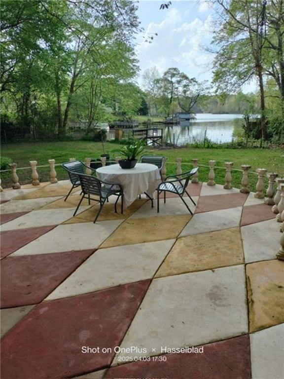 view of patio / terrace with a water view