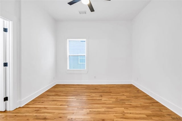 spare room with light hardwood / wood-style flooring and ceiling fan