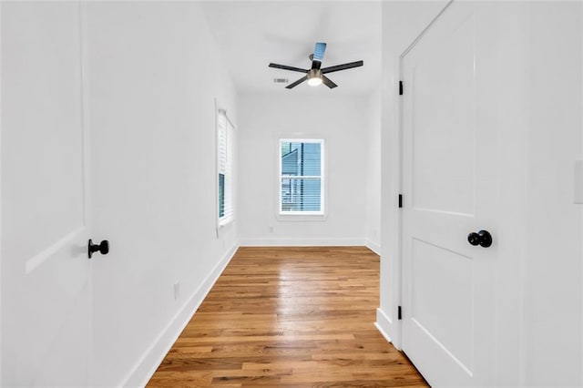 interior space featuring wood-type flooring and ceiling fan