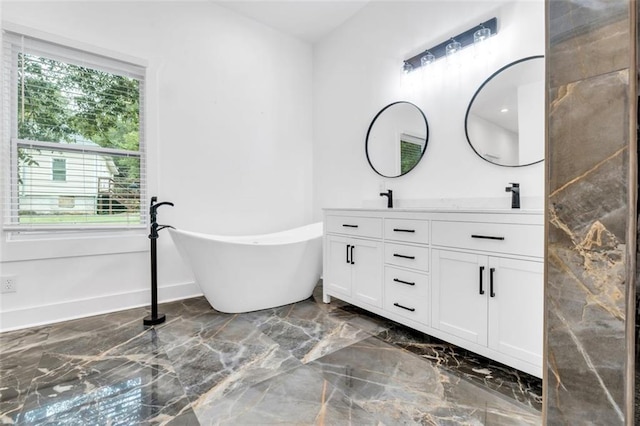 bathroom featuring vanity and a bathtub