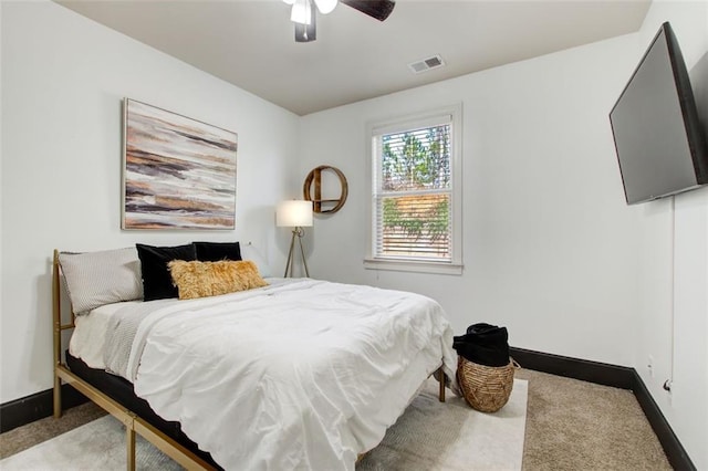 bedroom with carpet floors, baseboards, and a ceiling fan