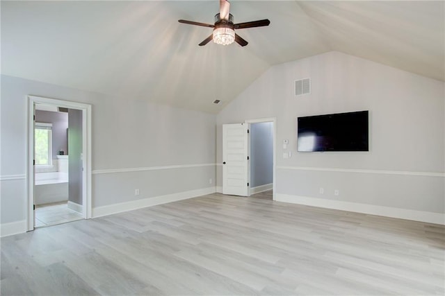 unfurnished living room with a ceiling fan, vaulted ceiling, and light wood-type flooring