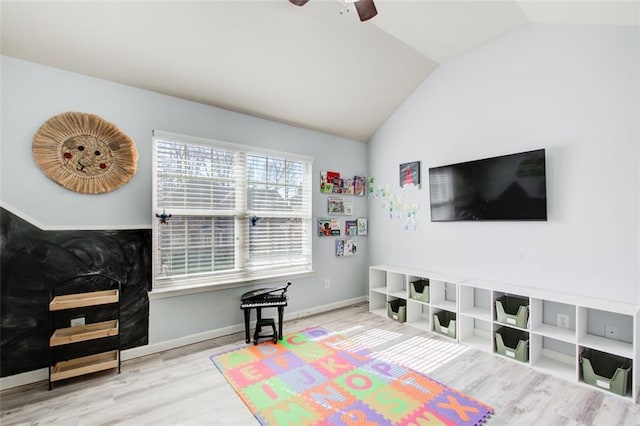 game room featuring wood finished floors, lofted ceiling, ceiling fan, and baseboards