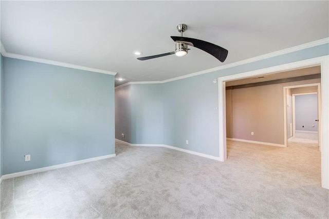 spare room featuring ornamental molding, a ceiling fan, baseboards, carpet, and recessed lighting