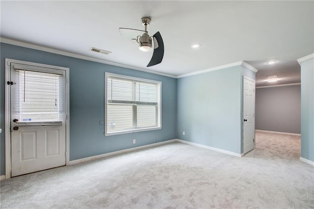 spare room featuring crown molding, a ceiling fan, carpet floors, baseboards, and recessed lighting