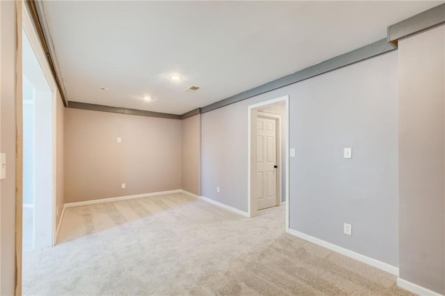 carpeted spare room with baseboards and recessed lighting