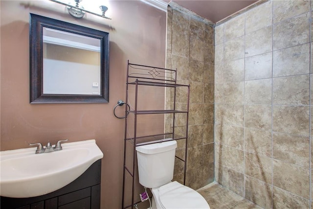 bathroom featuring toilet and vanity