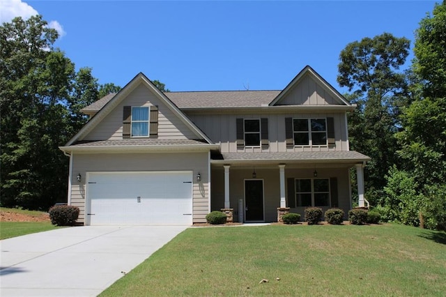 craftsman-style home with a garage, a front lawn, and covered porch