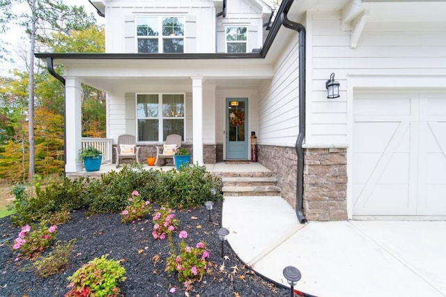 property entrance with a porch and a garage