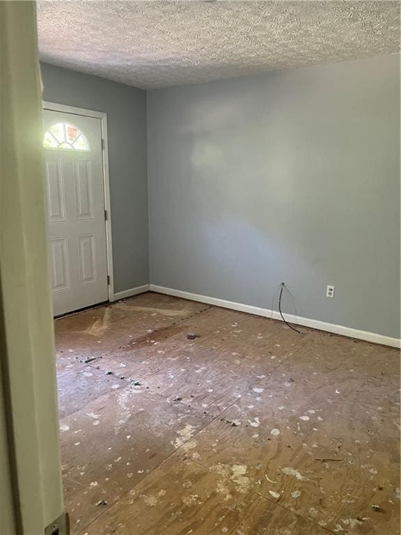 empty room with a textured ceiling