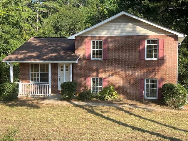 view of front facade with a porch and a front lawn