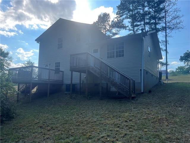 back of house with a yard and a deck