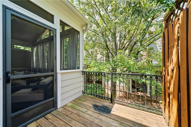 wooden deck featuring a sunroom