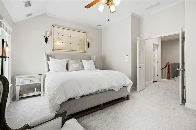 carpeted bedroom featuring lofted ceiling, ceiling fan, and ornamental molding