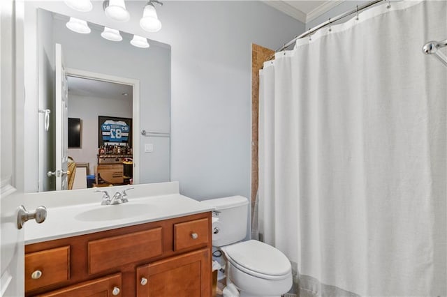 bathroom featuring vanity, toilet, crown molding, and curtained shower