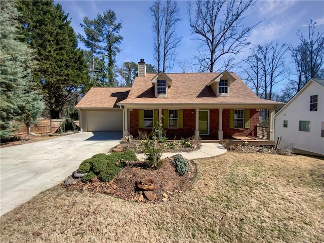 cape cod home featuring a garage, concrete driveway, fence, a porch, and brick siding