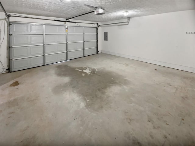 parking garage with baseboards, electric panel, and a garage door opener