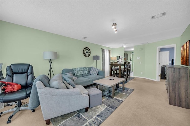 6178 Field Stone Dr, Douglasville, GA 30134 - living room with light carpet and a textured ceiling